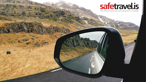 View of wing mirror driving through Iceland