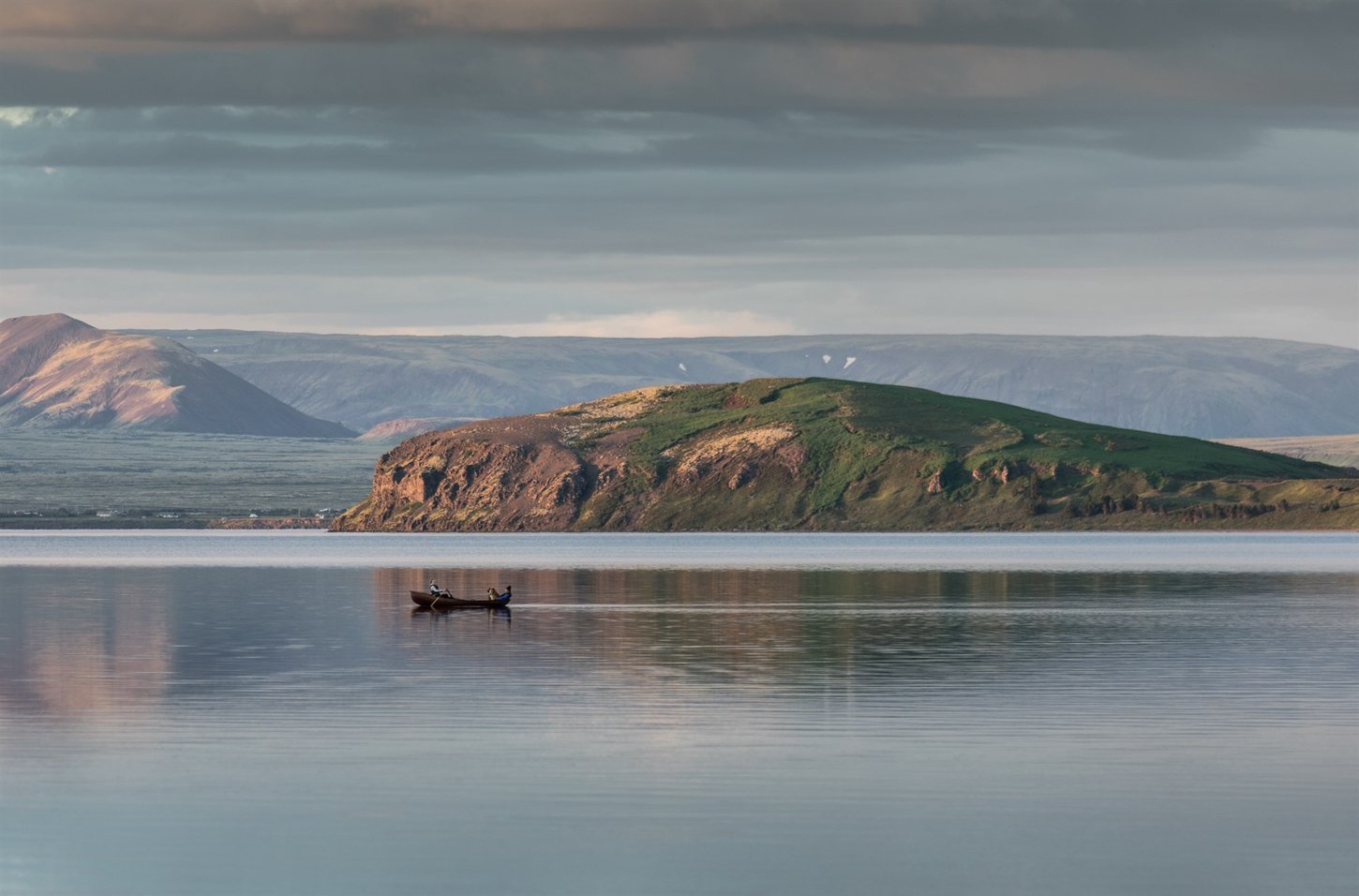 Boat on lake Þingvallavatn during summer in Iceland.