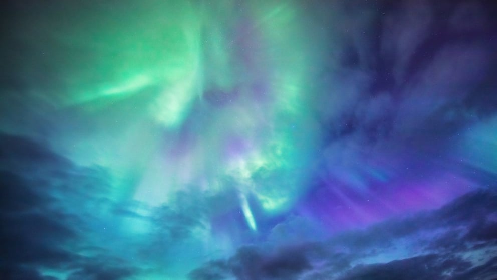 Blue, purple, and green Northern Lights in Iceland.
