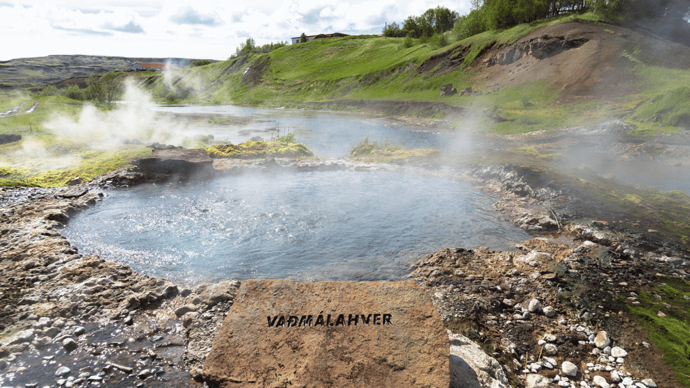 Steaming hot spring, one of the sources for the Secret Lagoon in Iceland.