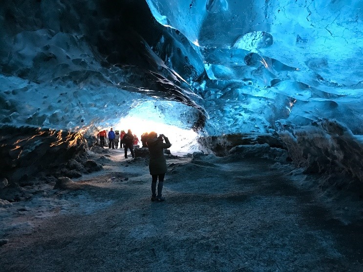Exploring ice cave in Iceland.