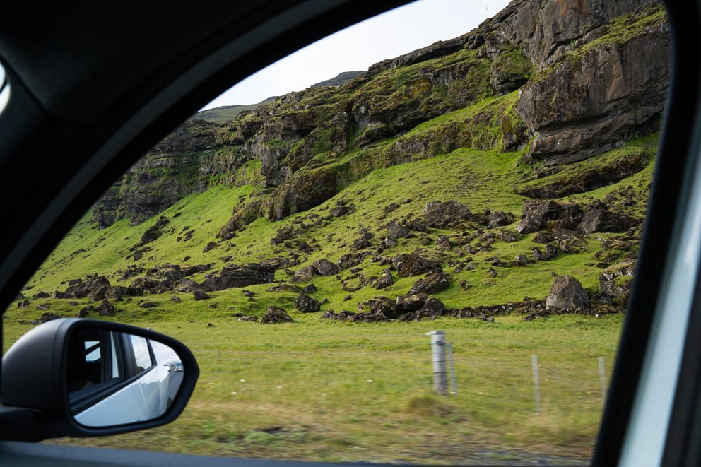 Image of looking outside the window of a moving rental car in Iceland