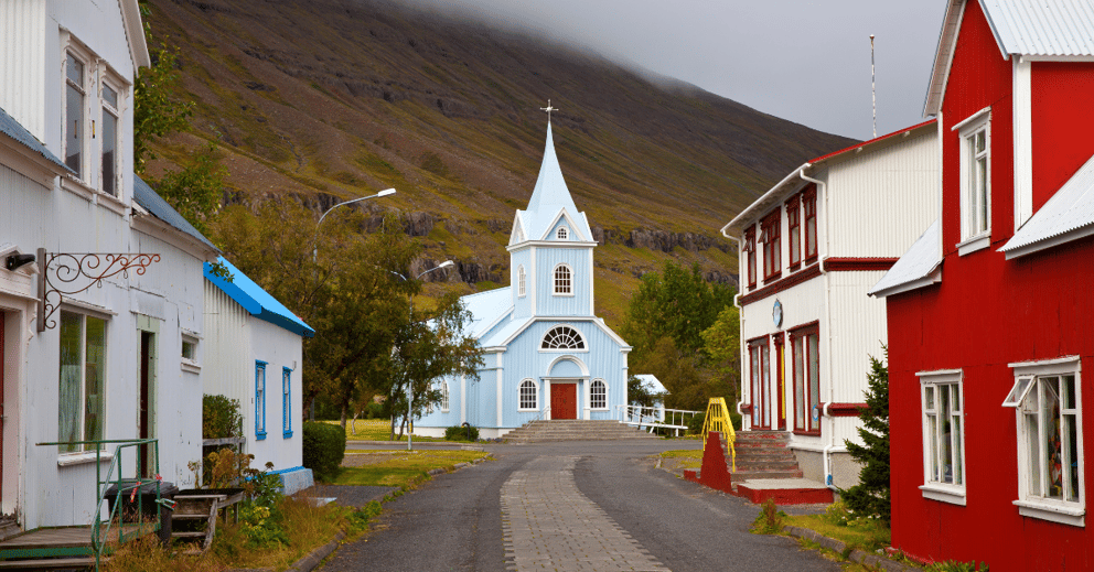 Iconic blue church and colourful buildings of Seyðisfjörður.