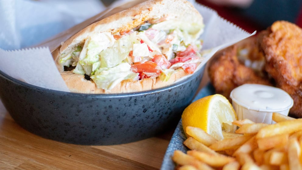 Fast food sandwich and fries with other fried foods.