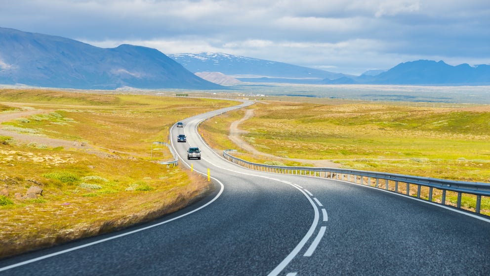 A winding road leading into the distance in Iceland.