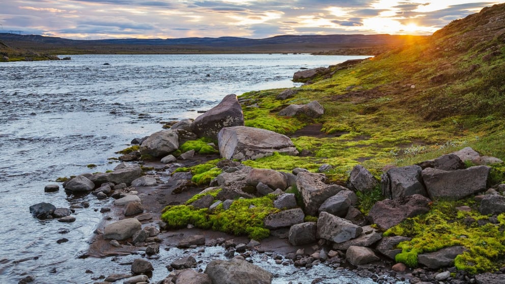 Midnight Sun near a river in Iceland.