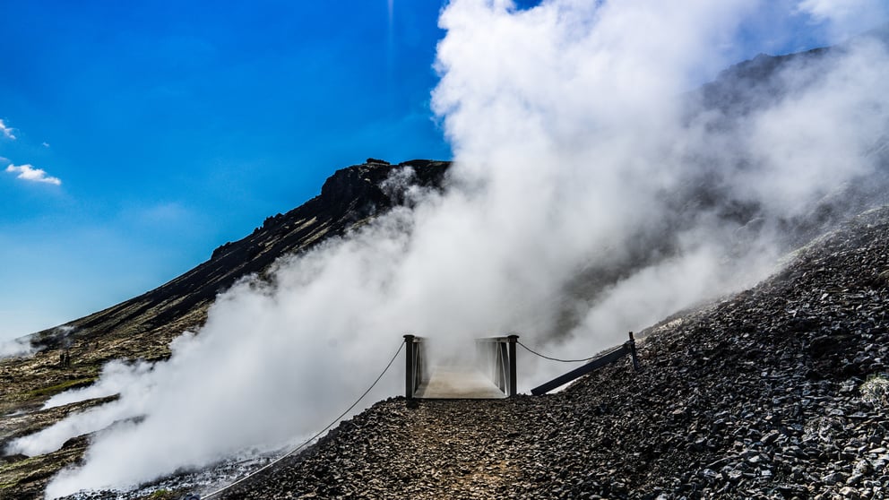 Reykjadalur Steam Valley on a clear day.