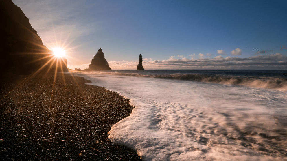 Sun setting over a beach in Iceland.