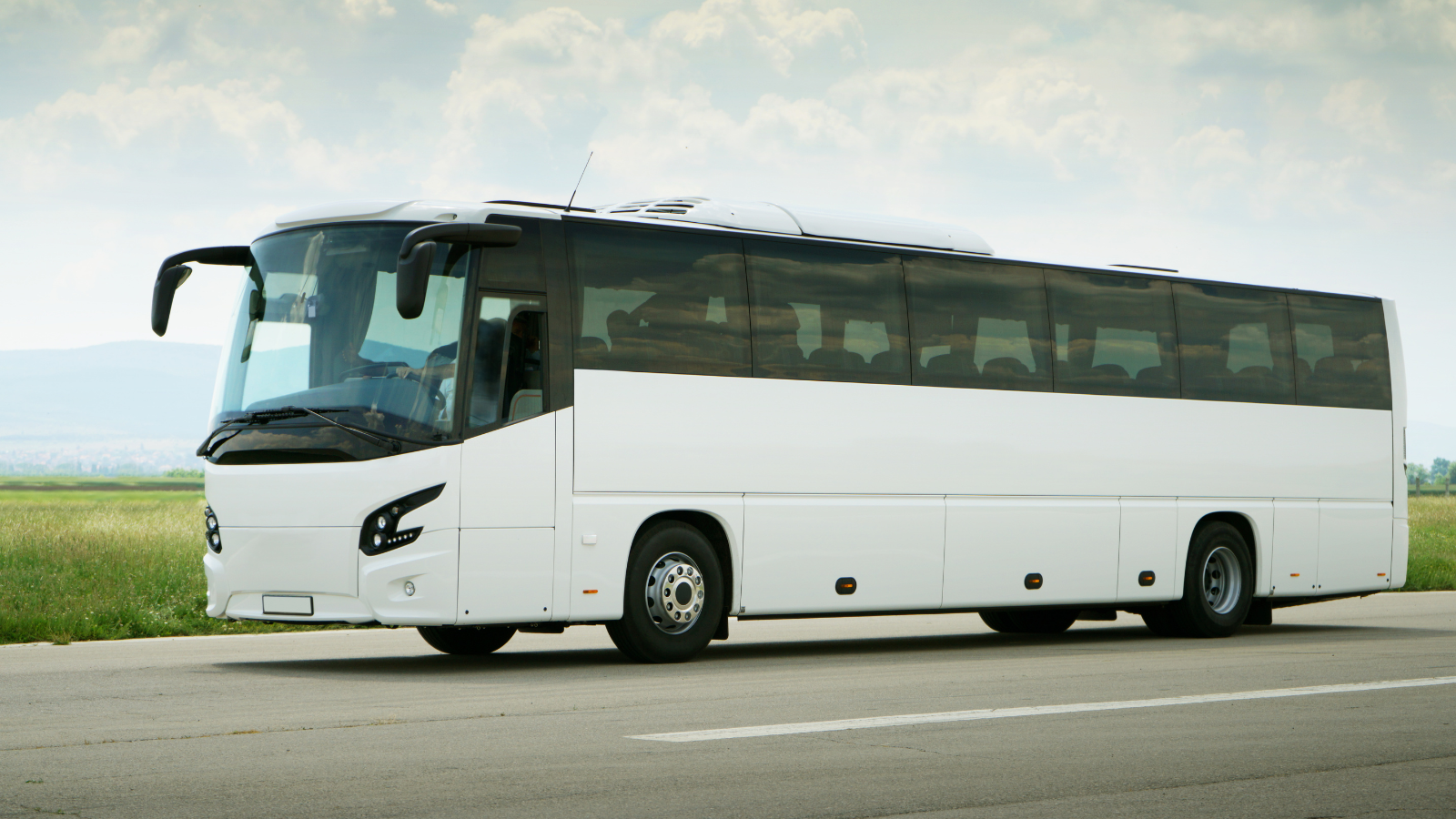 A shuttle bus on the road.