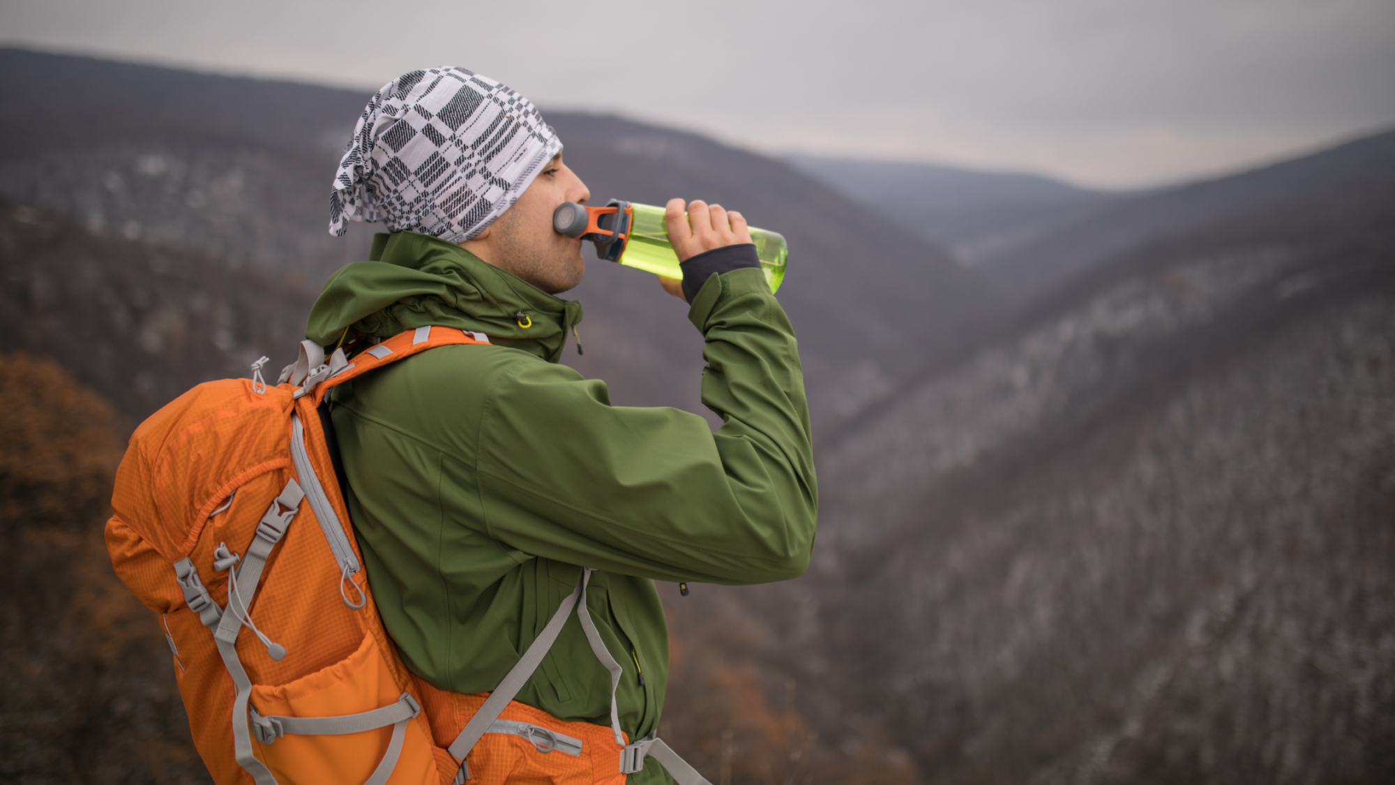 Man drinking Icelandic tap water from a bottle