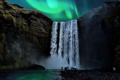 The Northern Lights over Skogafoss waterfall in Iceland.