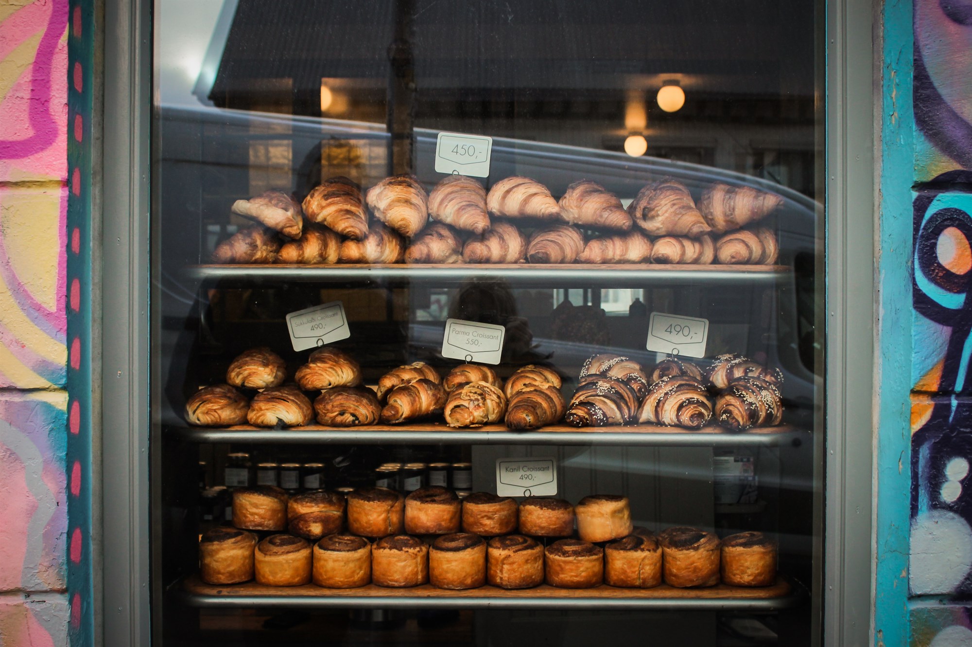 Piles of pastries in a window of Brauð & Co in Reykjavik, Iceland.