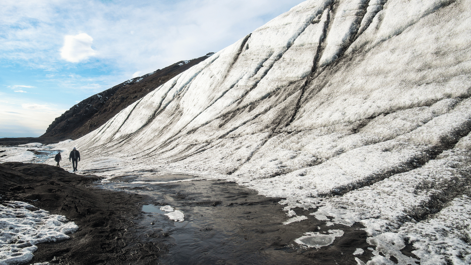 Most Famous Glaciers in Iceland Reading up before you book your tour? Here are just a few of Iceland’s most famous glaciers. Vatnajökull Located in the Southeast of Iceland, Vatnajökull is the largest glacier in Iceland, and in fact, the largest one in Europe. Its area spans around 8,300 square kilometers, or 3,200 square miles, which is just shy of 8% of the entire land mass of Iceland. Its size means that parts of it, often outlet glaciers or tongues, are visited as part of tours around Iceland.  Vatnajokull National Park encompasses a mere portion of the glacier, which is famous for great hiking opportunities, glacier hiking, boat tours on Jokulsarlon Glacier Lagoon, and even exploring ice caves on tours. Langjökull Located in western Iceland, Langjökull translates literally in English to “long glacier” for its long, thin shape. Langjökull is the second largest glacier in Iceland and is known to be much calmer in a volcanic sense than other areas of the country. With just a handful of eruptions in the past 10,000 years, exploring here is known to be very safe from volcanic activity.  This is also the closest glacier to Reykjavik, though still around 2.5 hours by car, so you are more likely to head here on day trips from the capital due to its proximity. It is also just beyond Þingvellir National Park, and meltwater from Langjökull feeds iconic attractions on the Golden Circle, such as the powerful Gullfoss Waterfall. Glacier hiking, ice climbing, and snowmobiling tours are all offered on this glacier and its outlets. Eyjafjallajökull While the other glaciers above are well-known for being larger and having more outlet glaciers and tongues, as well as lagoons, to explore, Eyjafjallajökull is famous for a more dramatic reason. Eyjafjallajökull glacier sits over the volcano with the same name, which became an almost household name back in 2010 (if you could pronounce it!). You may know the glacier as E15, shortened originally by a German reporter as news outlets struggled to pronounce the Icelandic word following the ash cloud that settled over Europe in 2010. We’re sure you’ll remember the hundreds of flights grounded across Western Europe as a result of the ash in the atmosphere, as well as the evacuation of around 500 local people. 