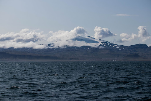 View of icy mountain caps from a ferry, Westfjords, Iceland 