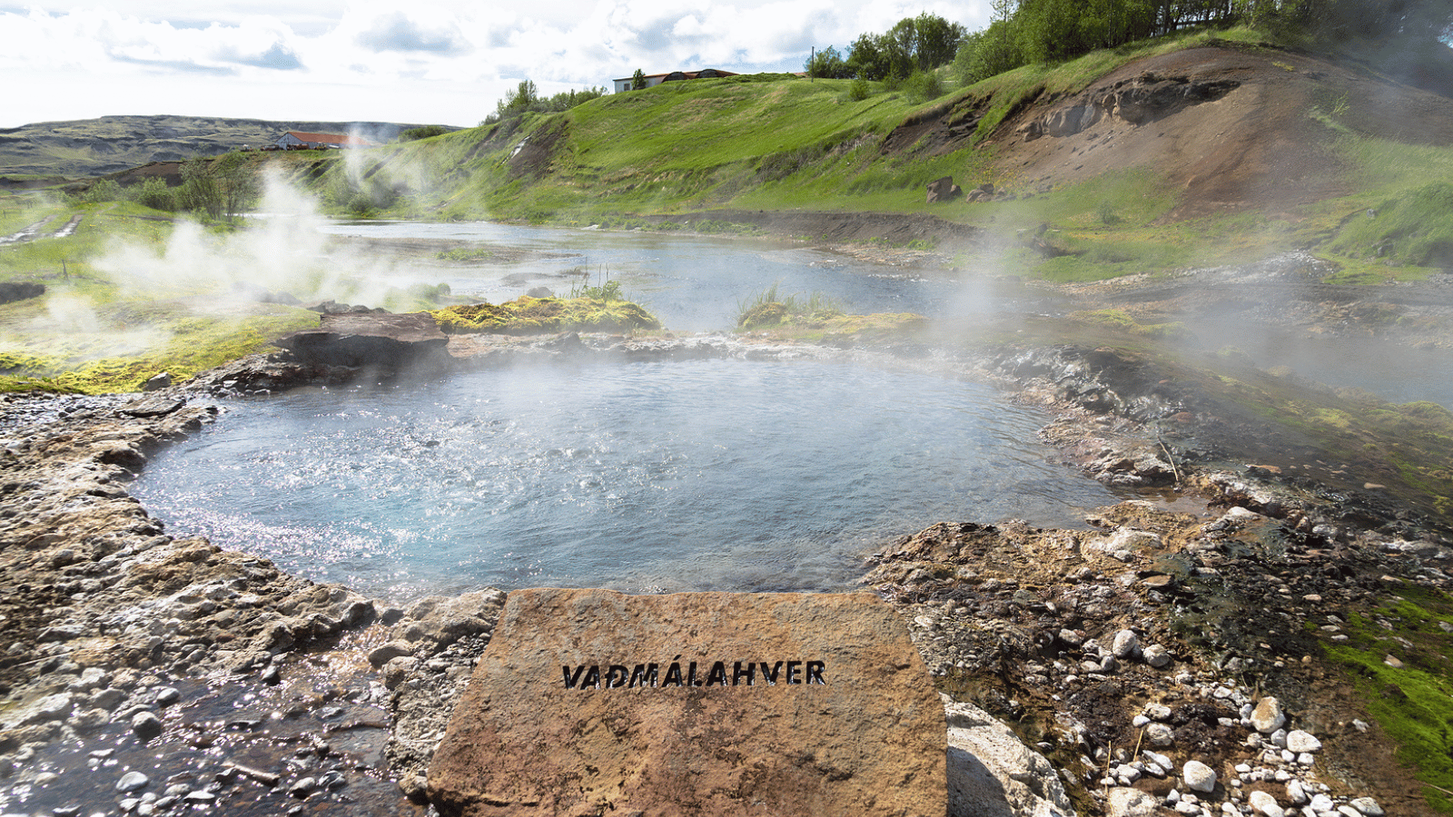 Steaming hot spring, one of the sources for the Secret Lagoon in Iceland.