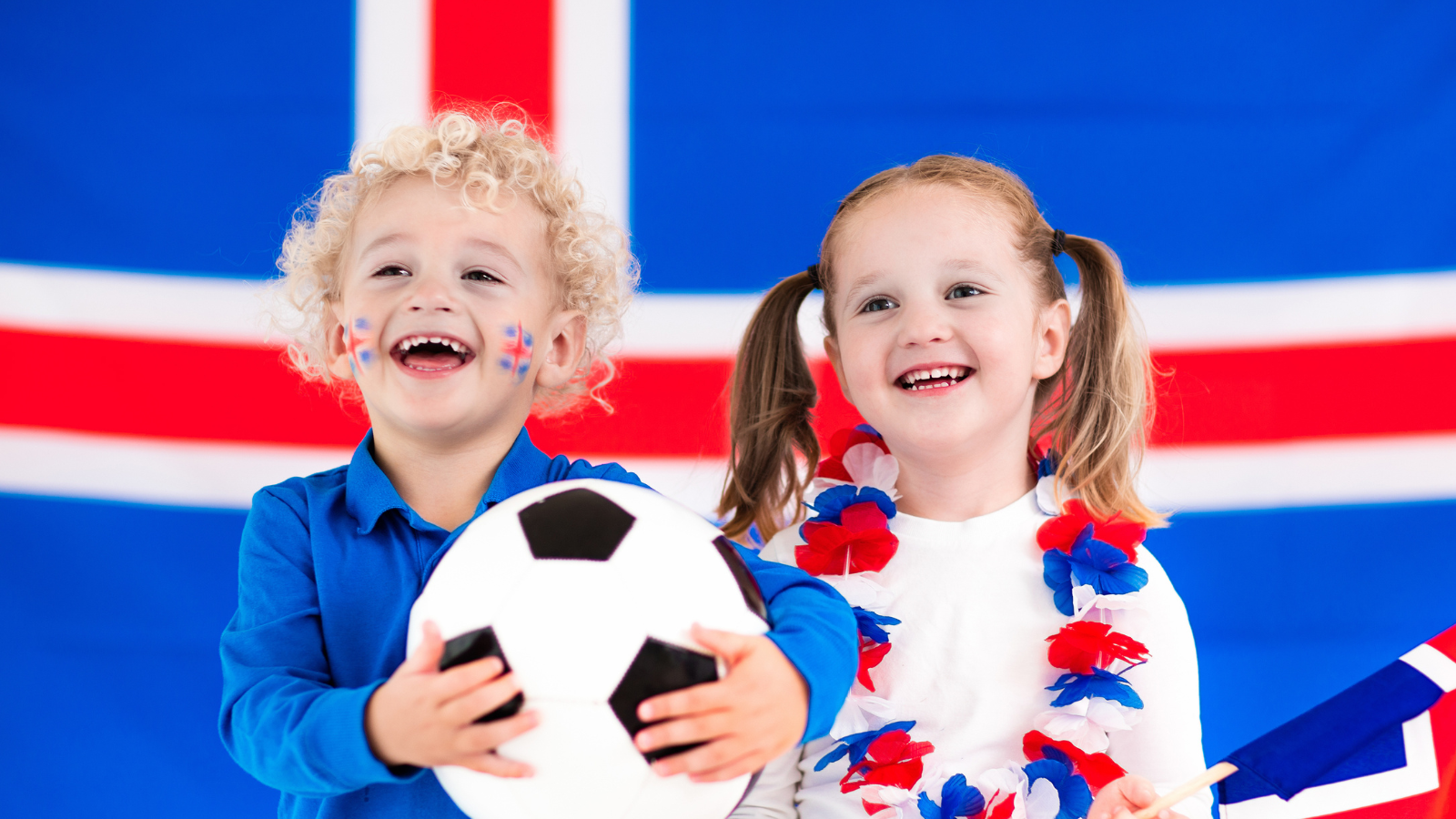  Kids cheering and supporting the Icelandic football team. 