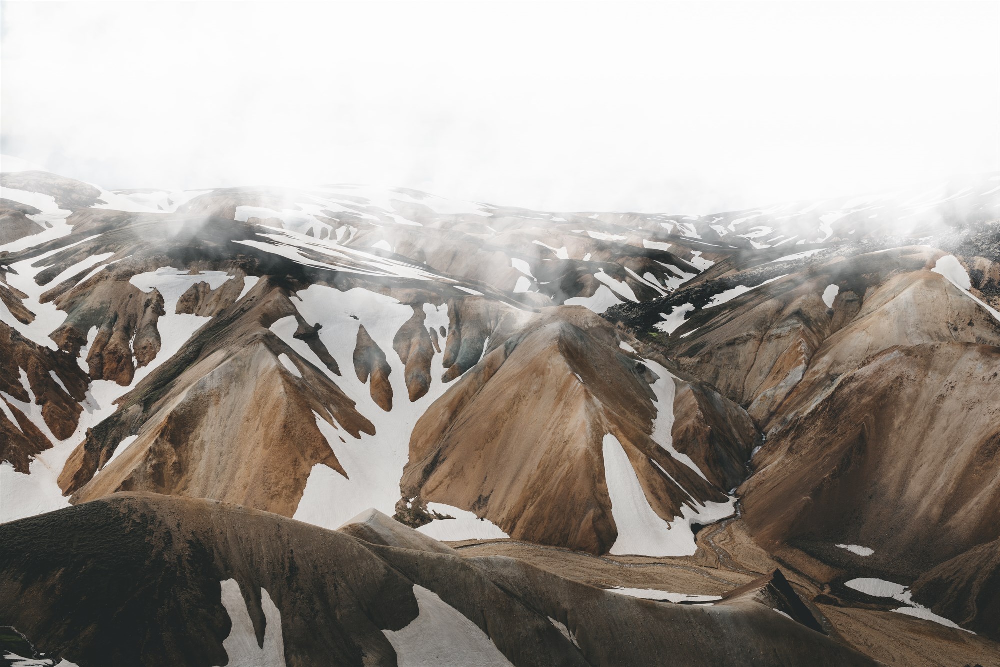 Snow and mist on the mountains in Landmannalaugar