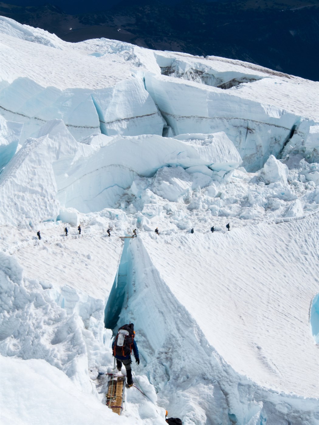 People walking on a glacier