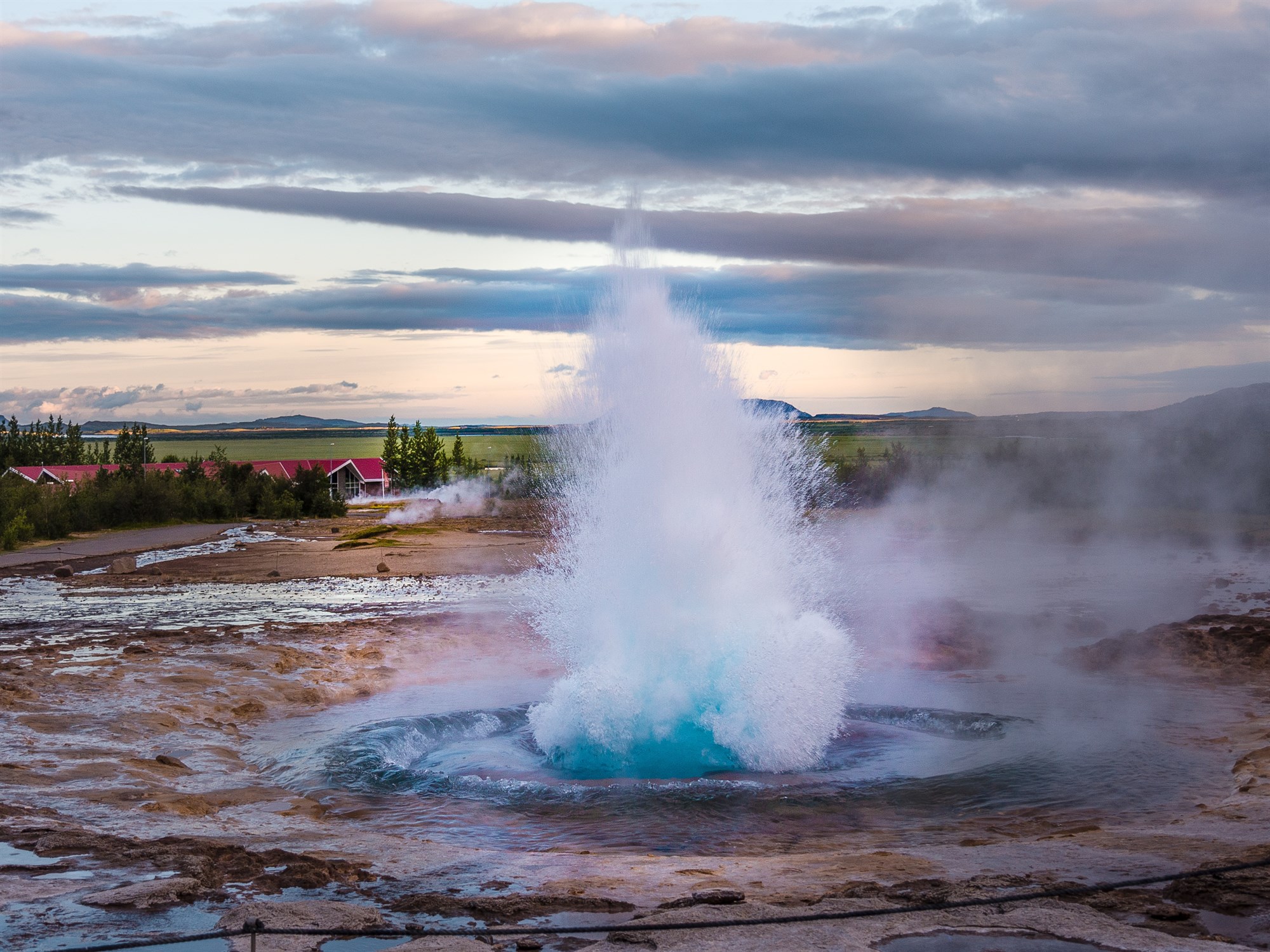 Geysir erupting in a geothermal area in Iceland