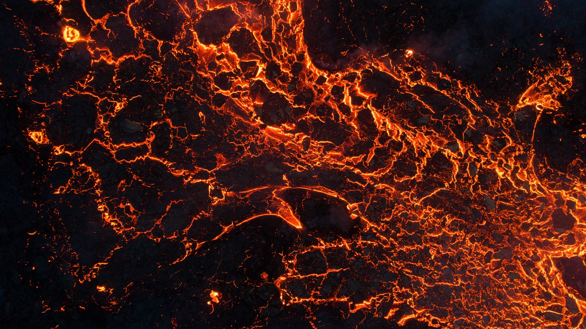Glowing field of lava from Icelandic volcano eruption.