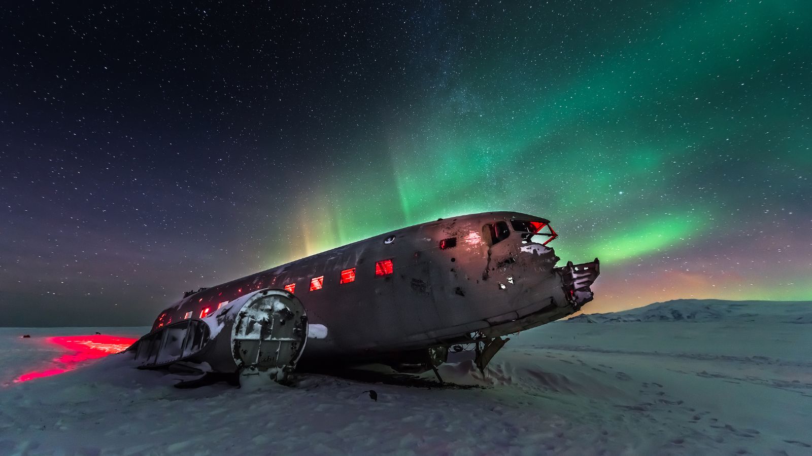 Northern Lights above the Sólheimasandur plane wreck. 