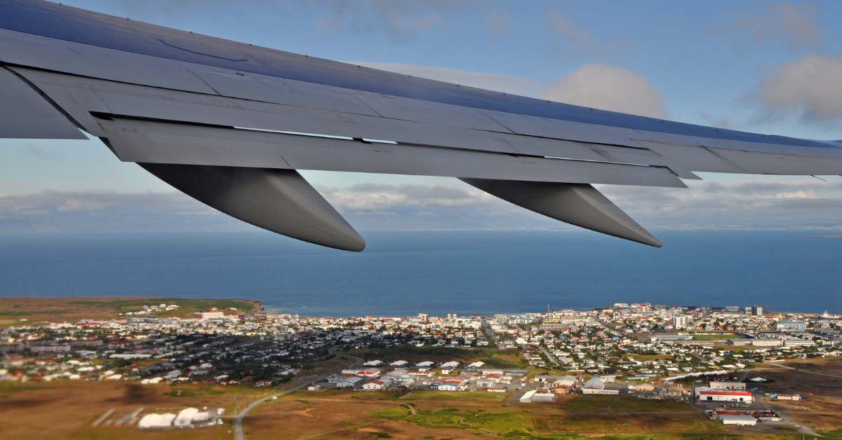 View of an aeroplane wing above Keflavik from the aeroplane window