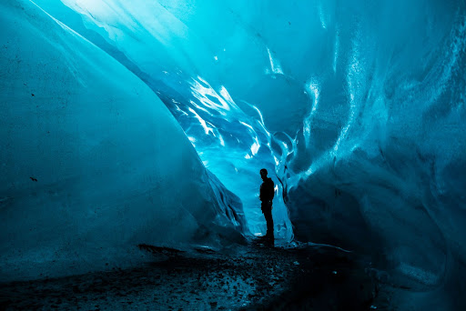 Person inside glacier in Vatnajökull National Park, Iceland